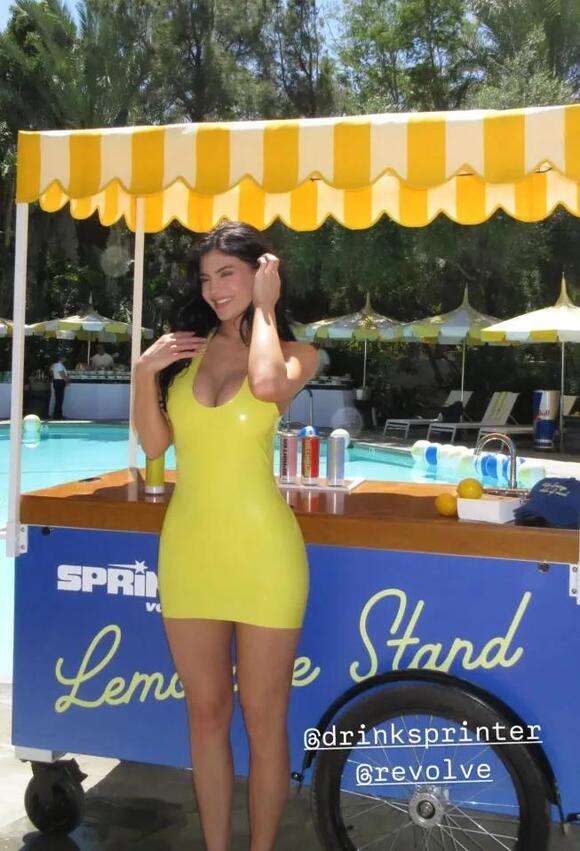 kylie jenner blue and yellow dress Kylie Jenner flaunts her incredible curves wearing a bright blue and yellow  dress in LA