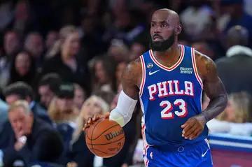 ‘Black sports are riddled with ungrateful people’: Brandon Tatum fumes after LeBron James practices his golf swing during the national anthem