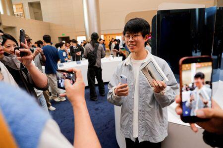 'Truly something cool': Apple fans react as iPhone Duo hits stores ...
