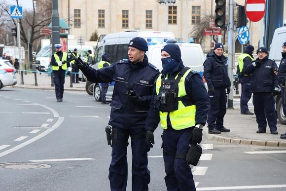 Woman killed, security guard seriously injured in ax attack at Polish ...