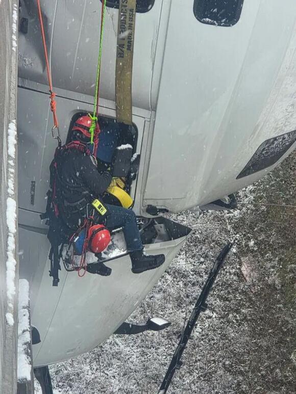 Truck driver left dangling 100 feet in air after horror West Virginia ...