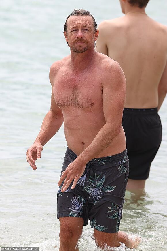 Just Like Fine Wine Shirtless Simon Baker 51 Proves He Is Getting Better With Age As He Shows Off His Fit Physique In The Surf News Break