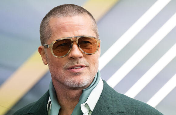 Brad Pitt's $400M Glow-Up Started in a Chicken Suit. But You'll Never Guess What Driving Job He Had Before 'F1' - NewsBreak
