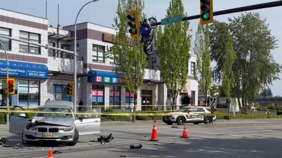 VIDEO: Motorcycle seen hanging off traffic light after crash - NewsBreak