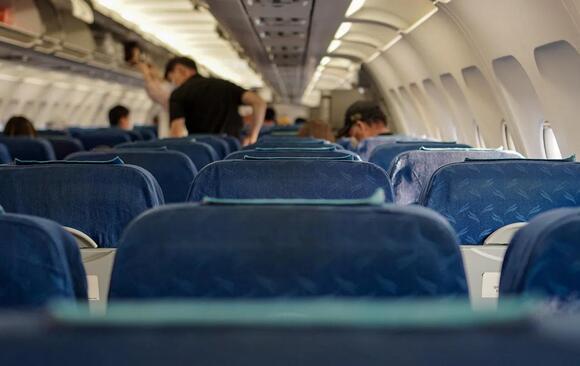 Why Airplane Tray Tables Have Gotten Smaller Over the Decades - NewsBreak