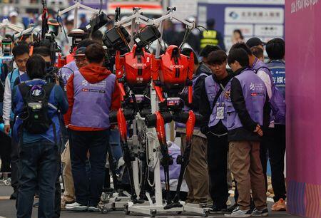 Humanoid robots race past humans in Beijing half-marathon, showing ...