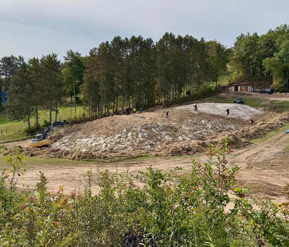 [PHOTOS] Trollhaugen, WI, Uncovers Snow Saved from Last Season for This ...