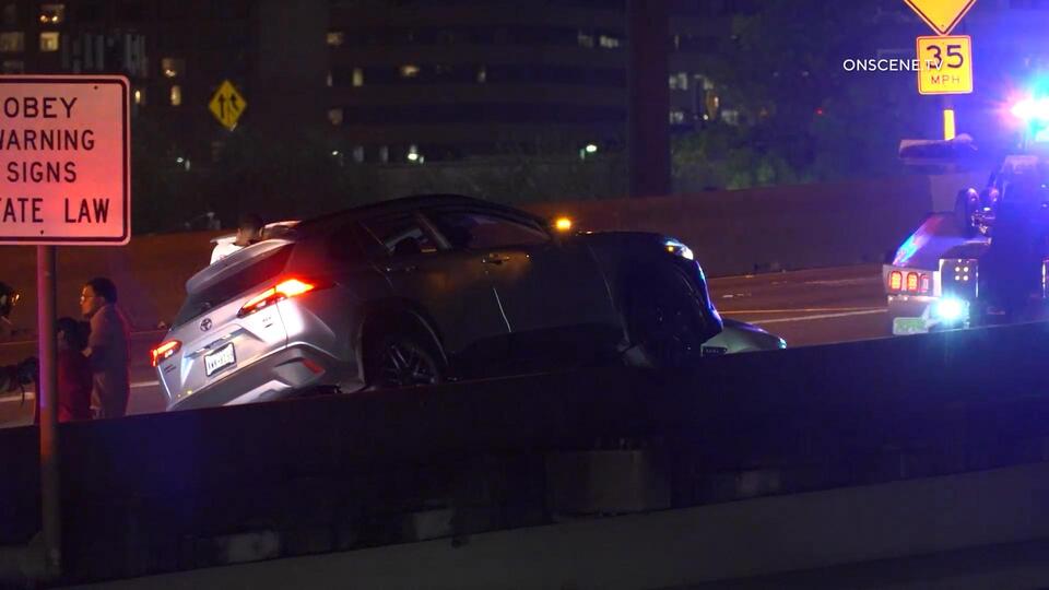 Car Ends Up On Concrete Freeway Barrier After Houston Crash - NewsBreak