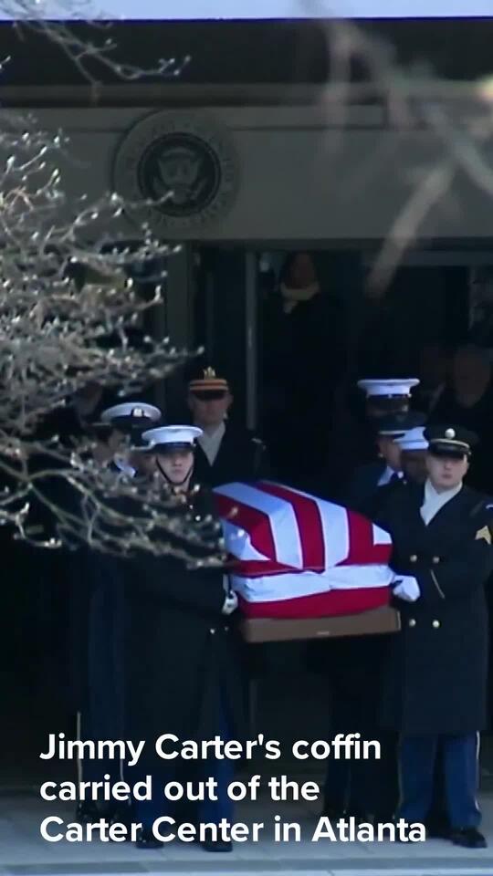 Jimmy Carter's casket carried out of the Carter Center in Atlanta ...
