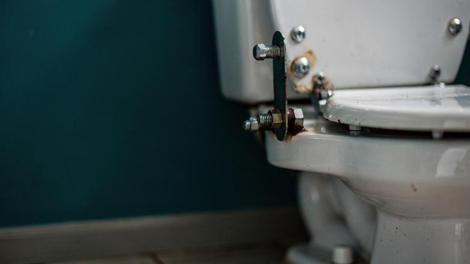 You tighten toilet tank bolts to stop a leak, but replacing a cracked tank can run $200 - $400