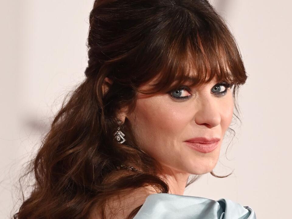 Zooey Deschanel's closet is a masterclass in using vertical space