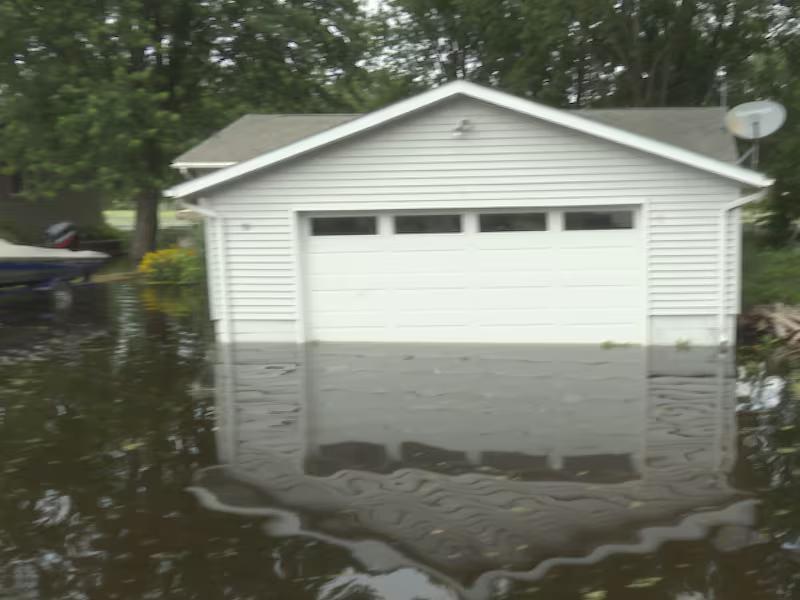 Rain causes Waterville lake to flood into community
