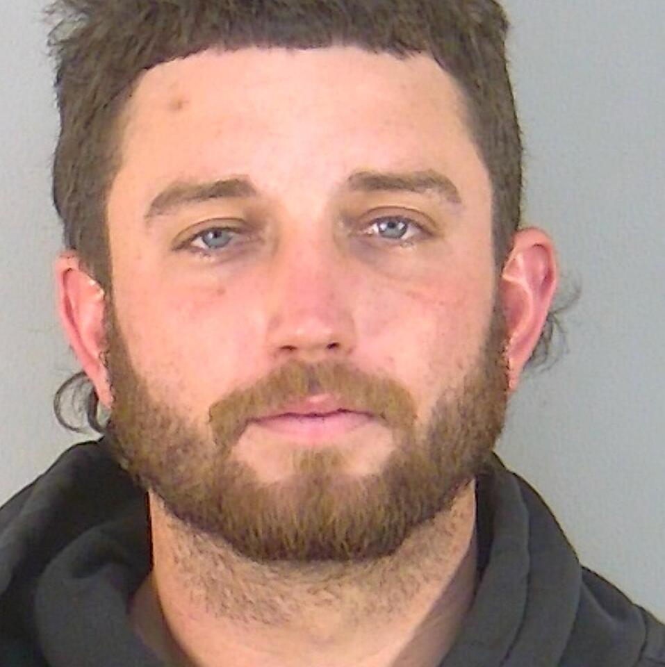 Two men stopped with narcotics and stolen firearm near convenience ...