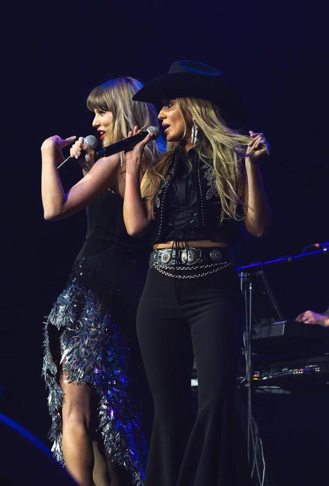 Taylor Swift joins Lainey Wilson onstage in surprise performance at Travis Kelce event