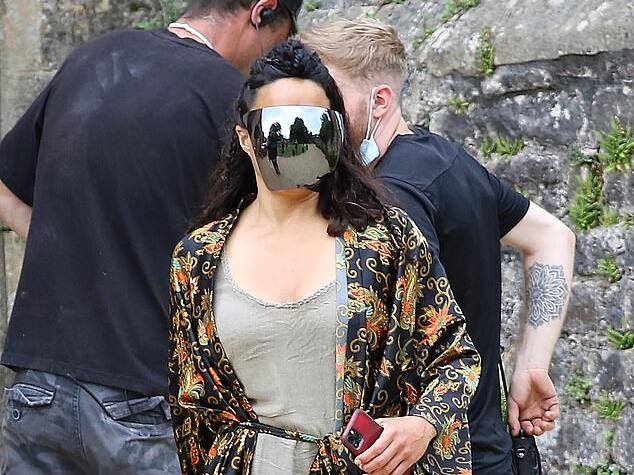 Michelle Rodriguez dons reflective visor and gets into character on set