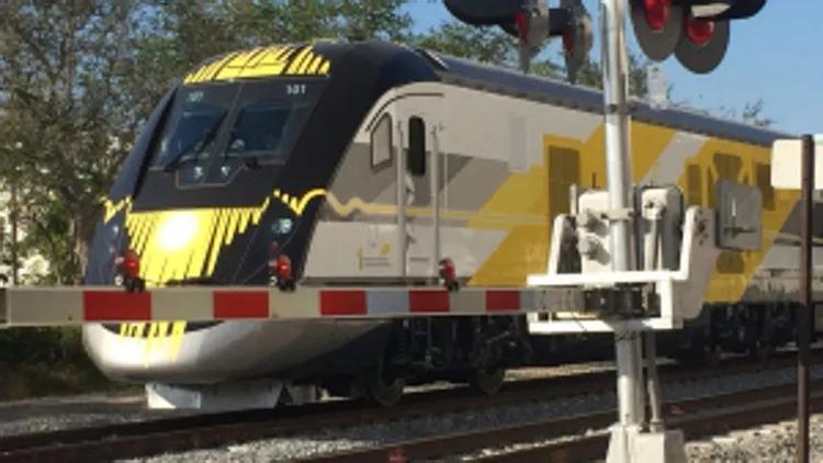 Brightline train slows prior to car crash in downtown West Palm ...