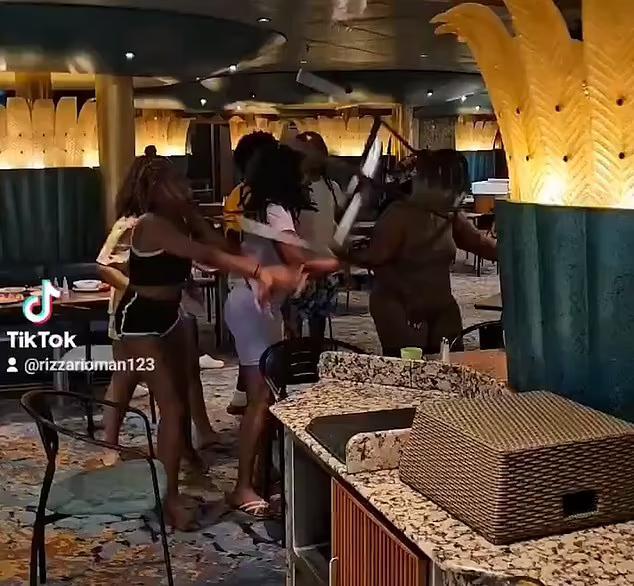 Moment shocked passengers watch as vicious brawl erupts on Carnival ...
