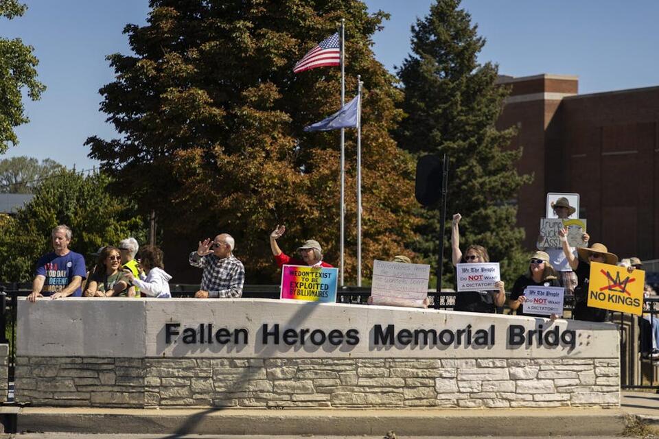 Labor Day protest held at Fallen Heroes Memorial Bridge - NewsBreak