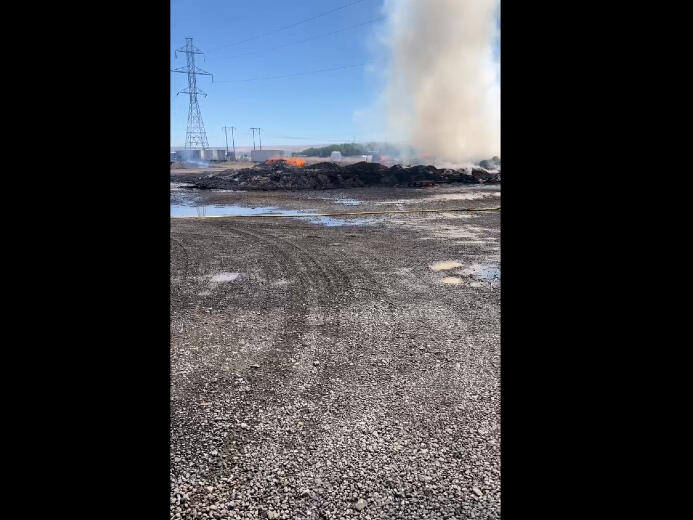 Fire destroys wooden pallets, outbuilding in Pasco