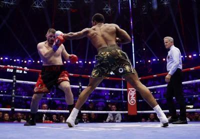 Anthony Joshua Survives Two Knockdowns, Stops Kristian Prenga in Two