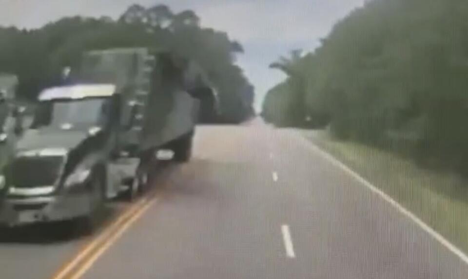 Truck driver killed in crash after load cover flew off passing big rig ...