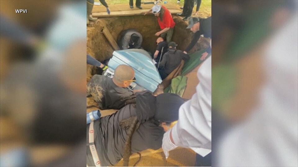 Philadelphia funeral turns chaotic after pallbearers fall into grave