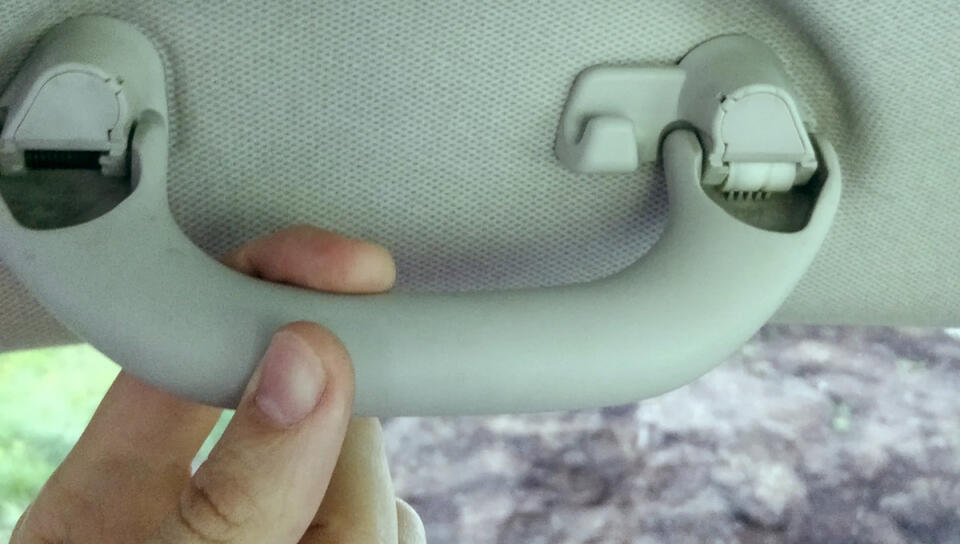 Why Cars Have a Grab Handle Above the Window—and What the Small Hook ...