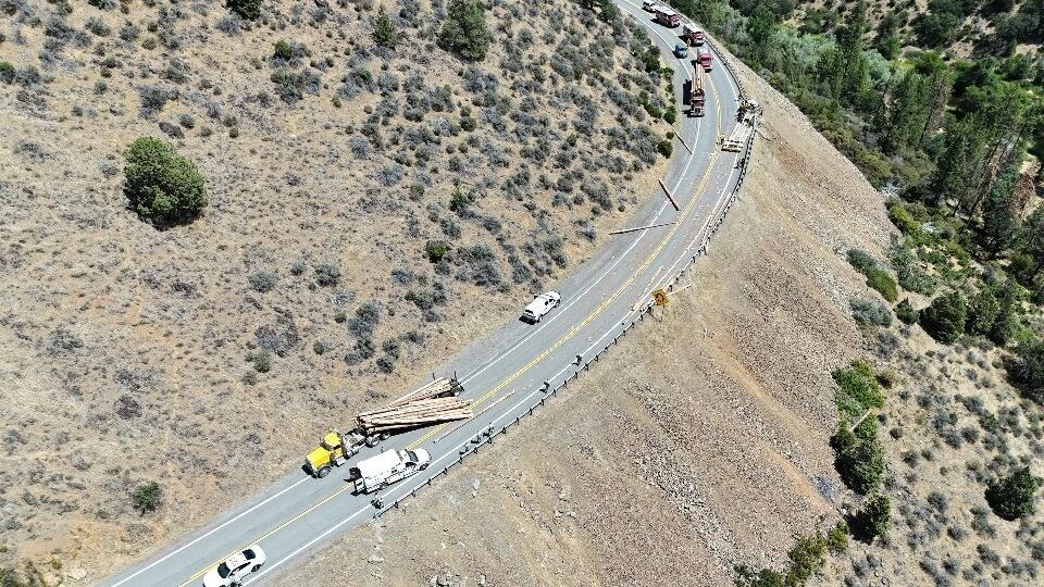 Two big rigs crash on rural California highway spilling lumber across ...