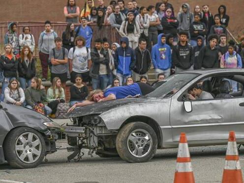 Mock crash teaches Valley High students dangers of distracted driving
