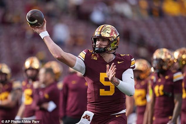 College football player kicks his own quarterback in the groin as ...