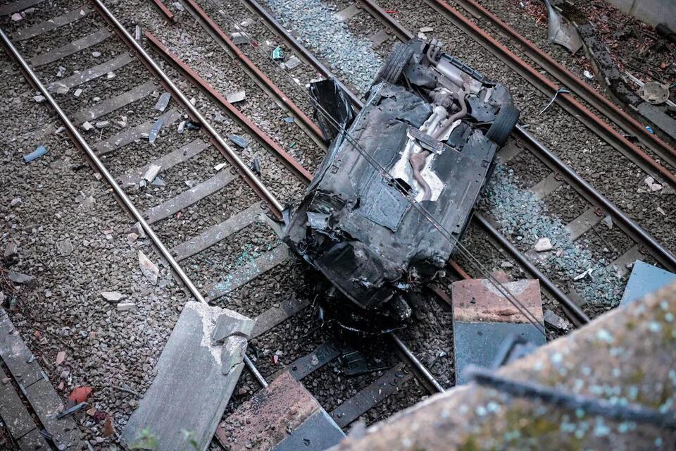 Liverpool-Manchester train line closed after car plummets onto rail ...