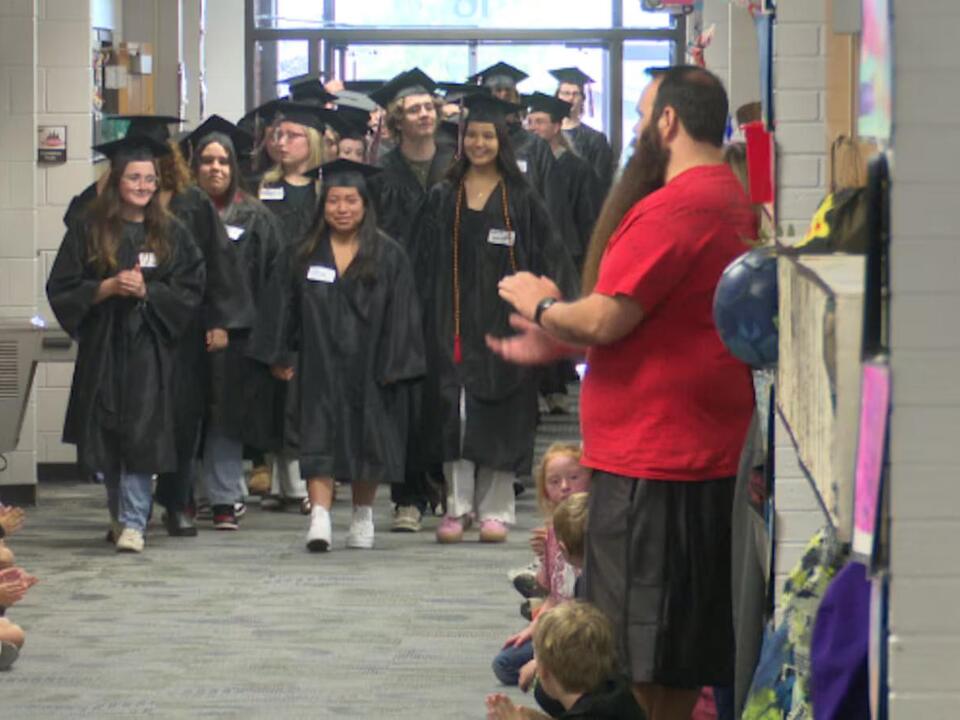 Mandan High School seniors visit their elementary schools