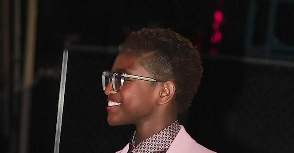 Zaya Wade Plays With Patterns in a Printed Top, Rib-Knit Pants and Green Platform Sandals – NewsBreak