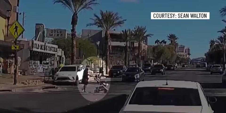 VIDEO: Pedestrian with baby stroller crosses street after some drivers ...