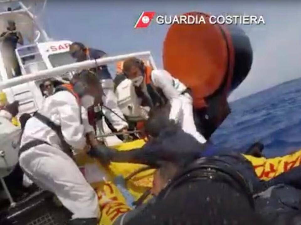 About 20 migrants are reported missing after their boat capsized off Italy