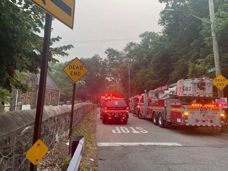 Firefighters handle brush fire near Staten Island church
