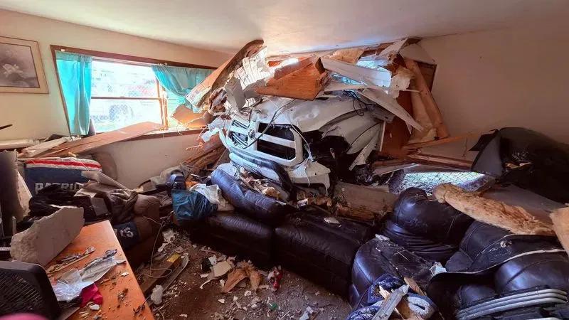 One person hospitalized after truck crashes into living room of Fall River home