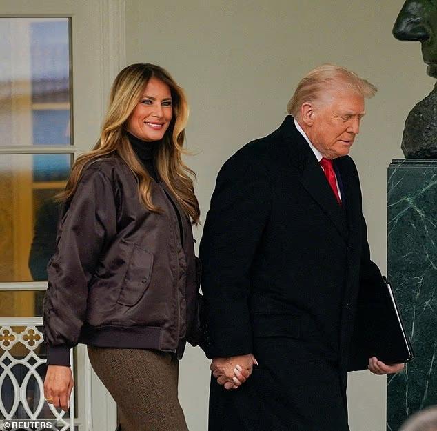Melania Trump braves gloomy D.C. weather in oversized bomber jacket ...