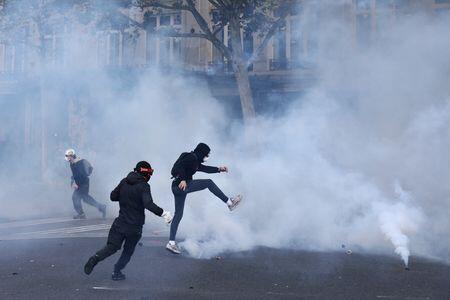 French police clash with protesters as tens of thousands rally over ...
