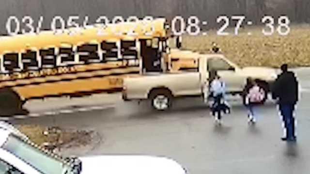 'Visibly upset, shaking': Video shows truck drive around bus, nearly ...