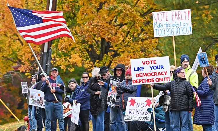 Protestors urge residents to vote early in upcoming mid-term elections