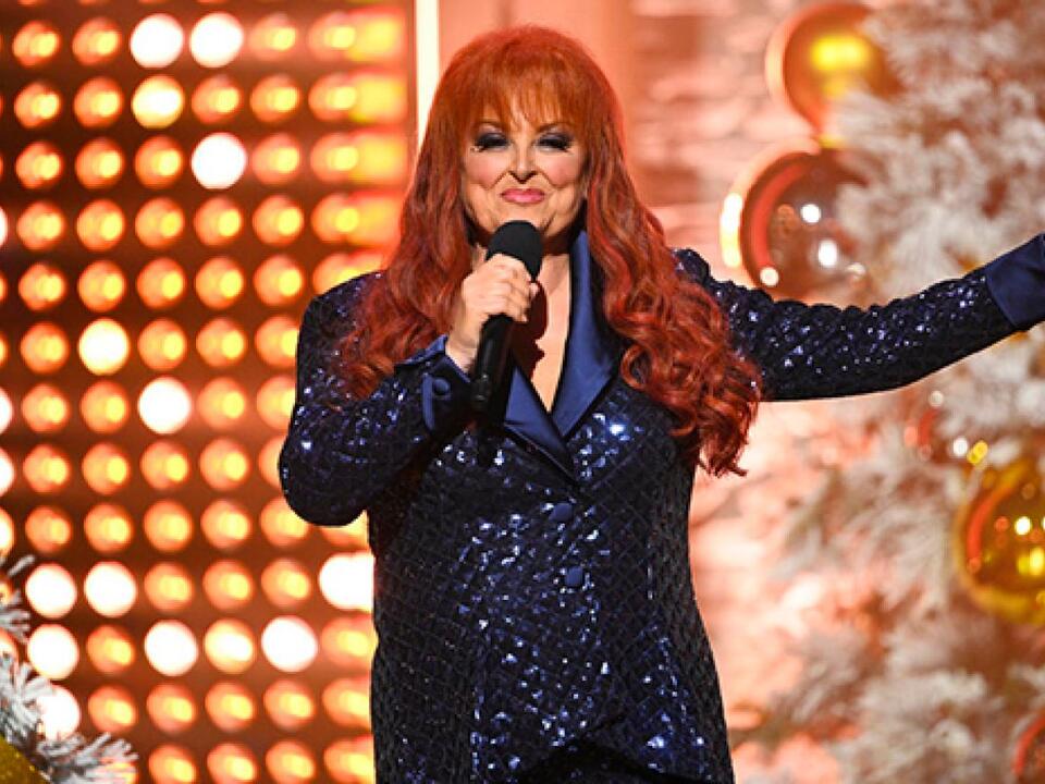 Wynonna Judd Dazzles in Navy Sequin Pantsuit as She Hosts ‘Christmas at(02)