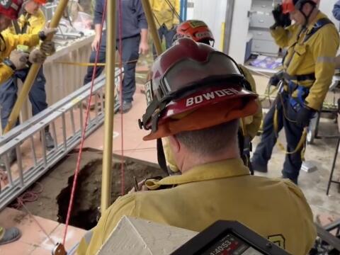 Woman rescued, yelling for help, after fall into California sinkhole