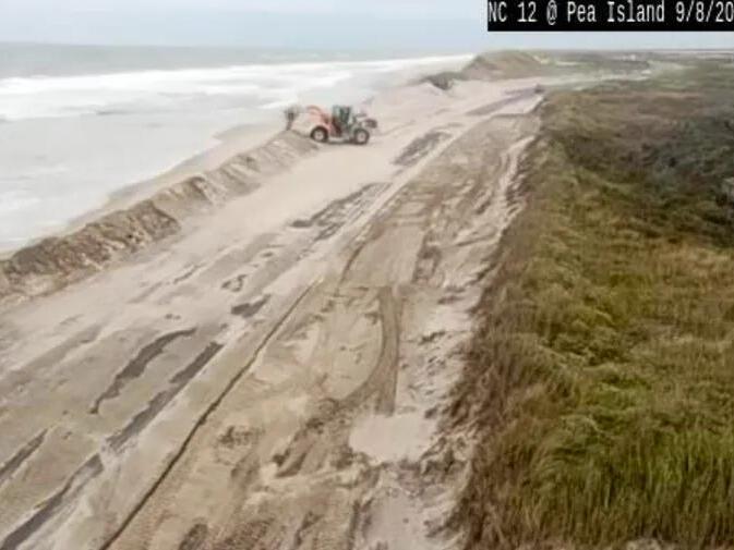 Outer Banks surf washes away Pea Island dunes, flooding highway