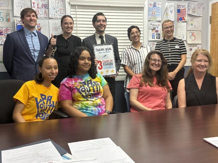 Cheering additional school funding