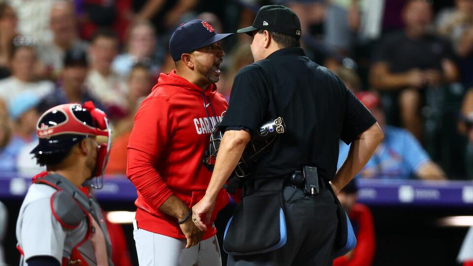 hungry' umpire Doug Eddings, who told rookie to straighten hat