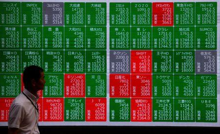 Tech leads shares higher in Asia, oil eases
