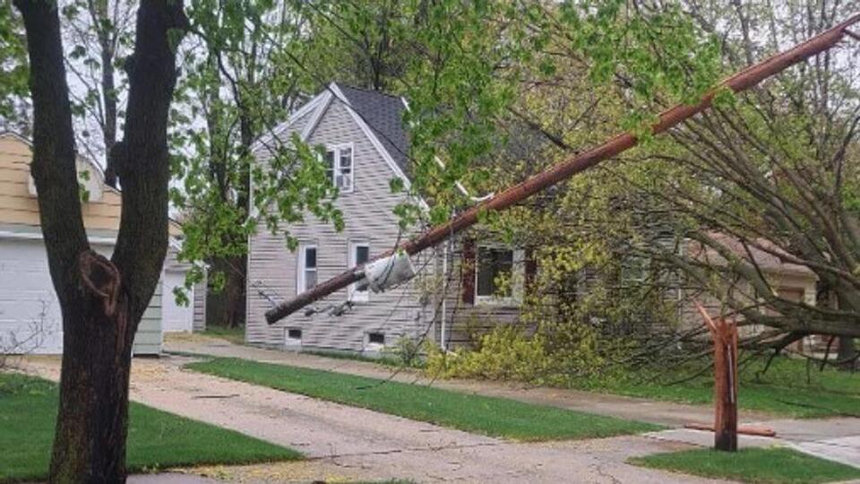 Storm topples trees and power lines across Two Rivers as outages near ...
