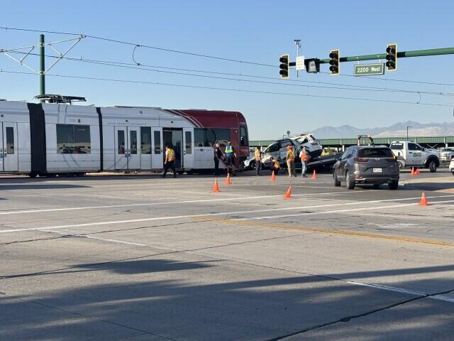 UTA TRAX derails injuring two following collision with car