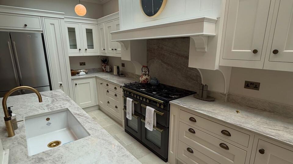 An Oak Kitchen Island Reveals a Curved Seating Nook on the Other Side ...